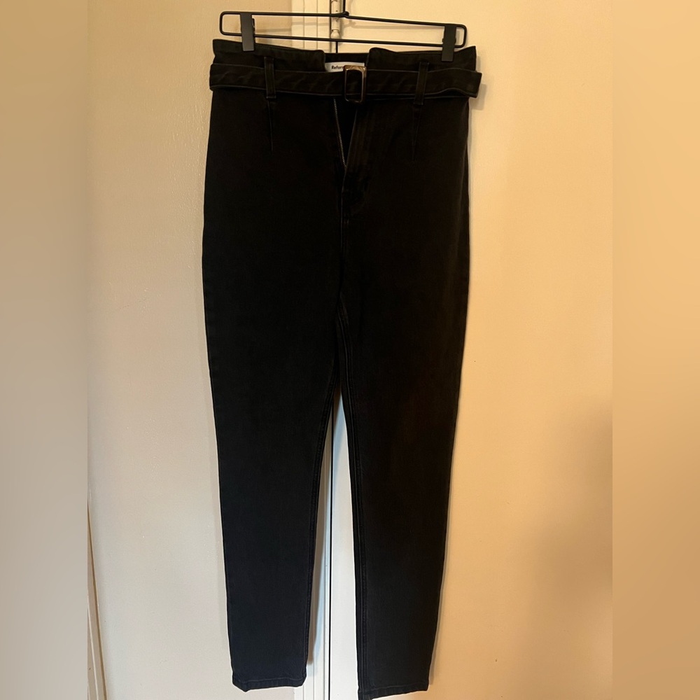 Reformation belted black skinny jeans